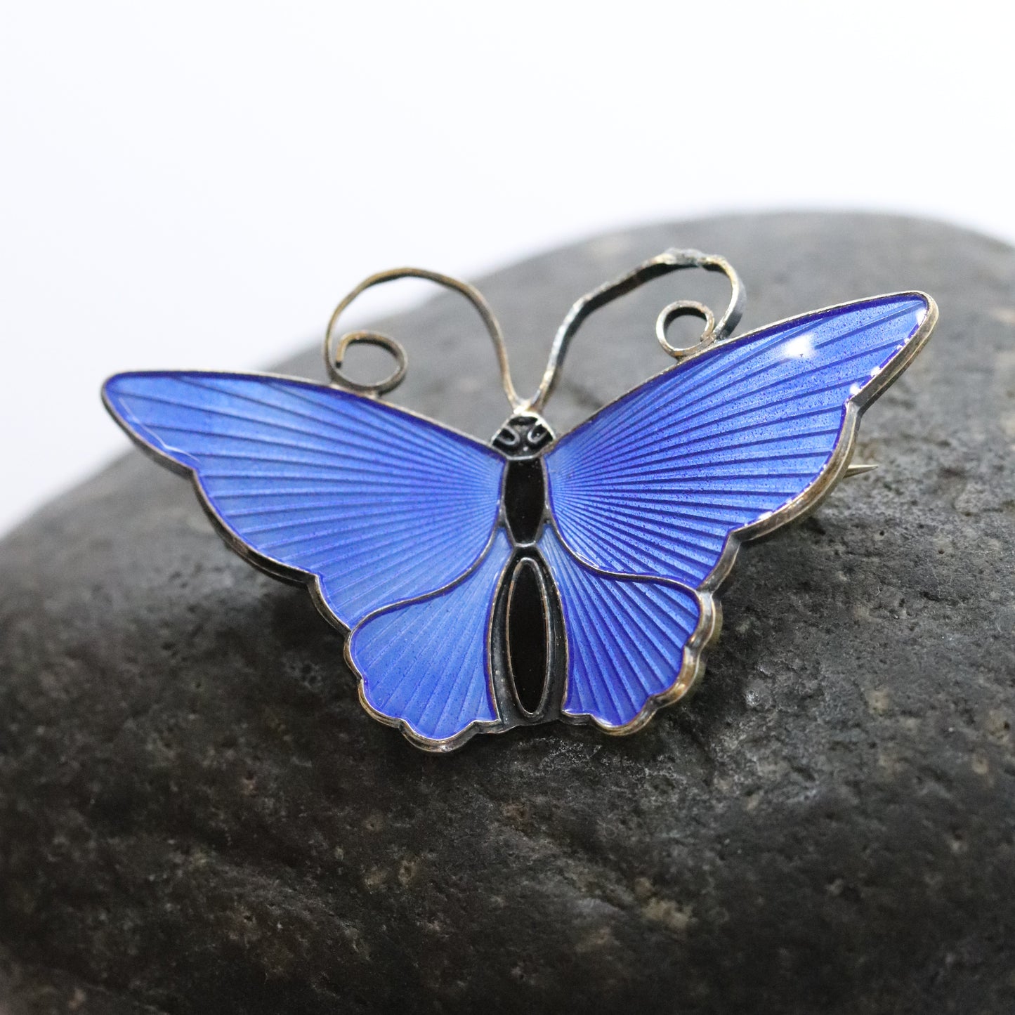 David Andersen electric blue enamel butterfly brooch on dark stone