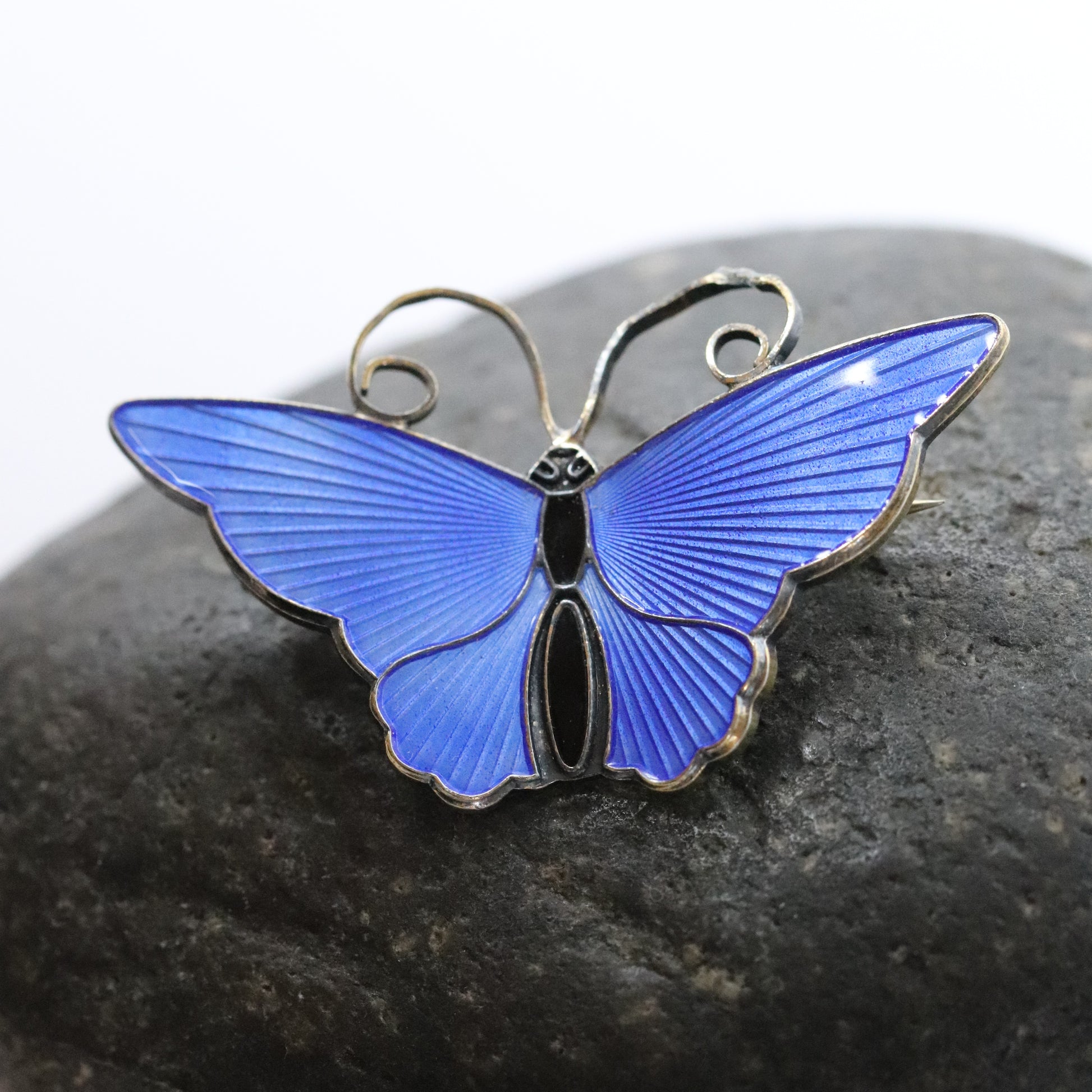 David Andersen electric blue enamel butterfly brooch on dark stone