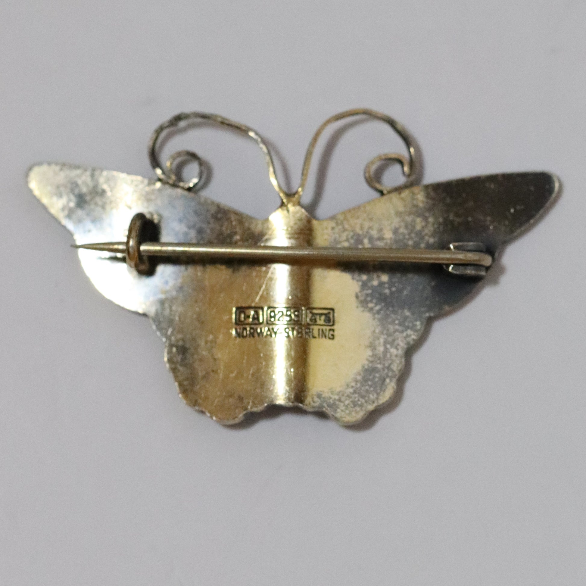 Back of David Andersen sterling silver butterfly brooch with hallmark and pin clasp