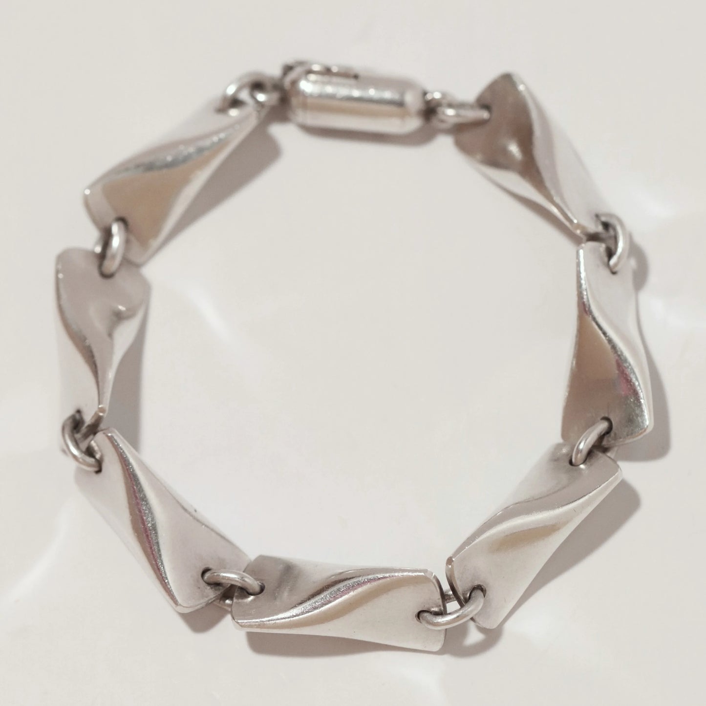 Georg Jensen vintage silver bracelet with sculpted twisted links on white background