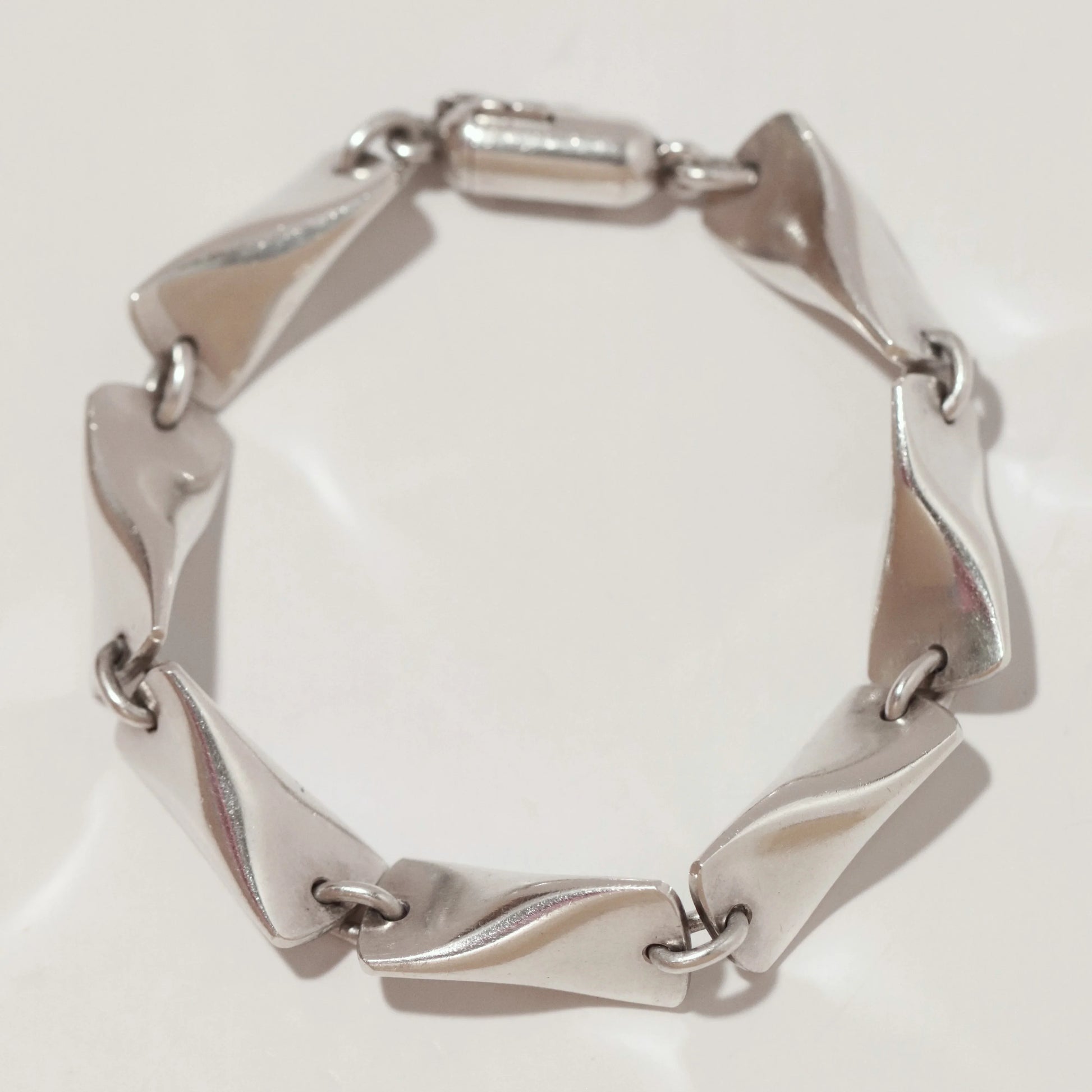 Georg Jensen vintage silver bracelet with sculpted twisted links on white background
