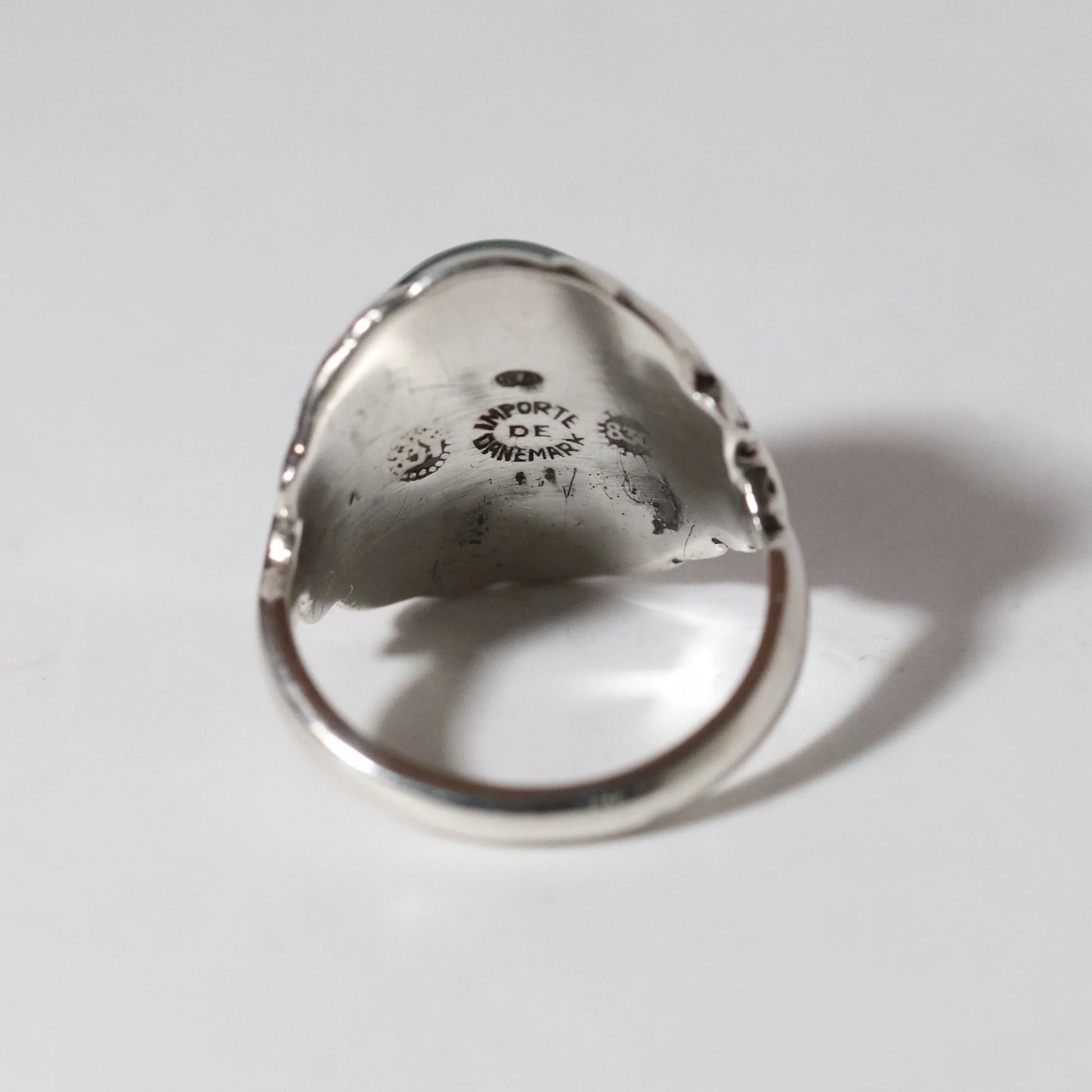 Georg Jensen Danish designer silver ring, hallmark inside, vintage artisan jewelry on white background