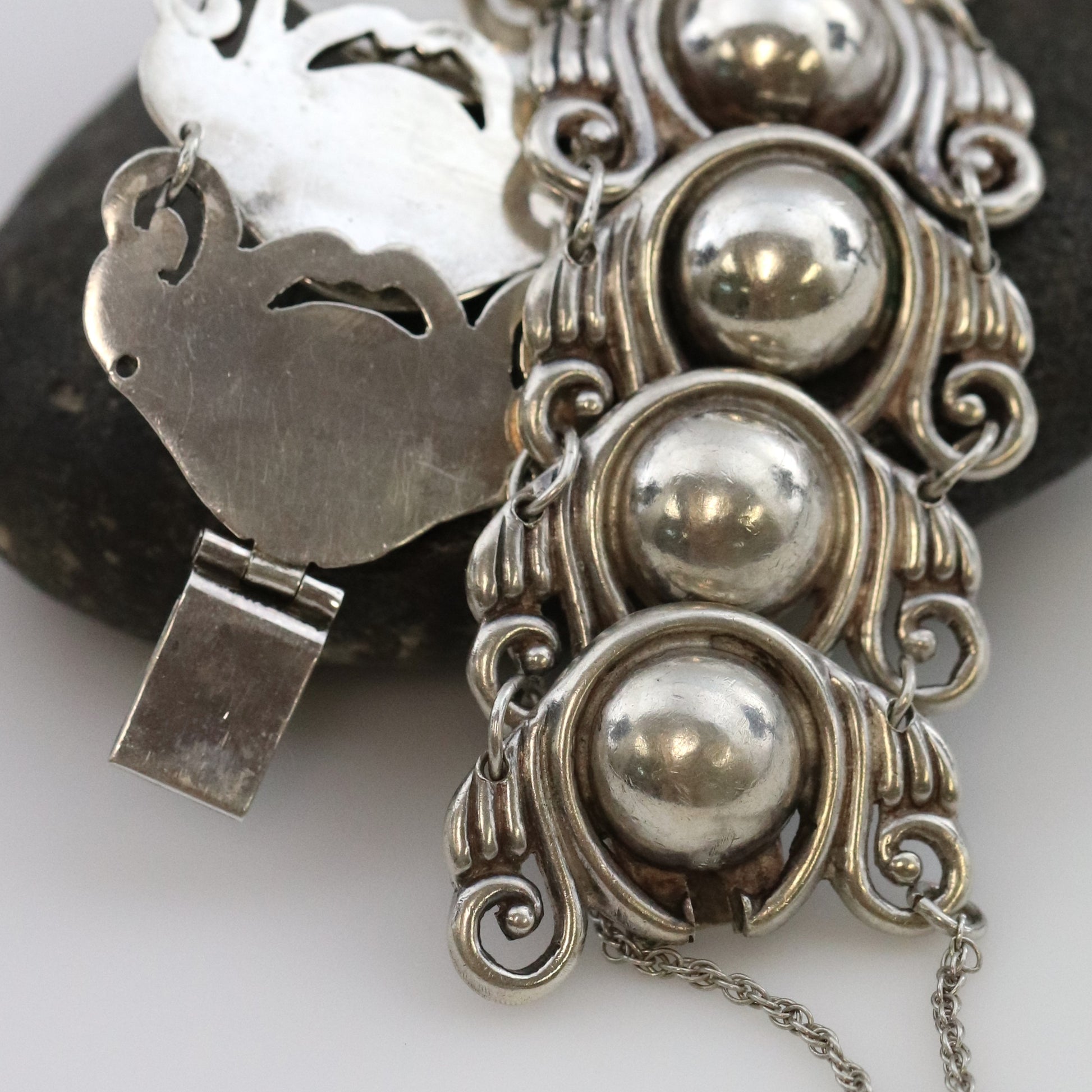 Los Castillo Taxco silver cabochon bracelet with ornate scrollwork and box clasp