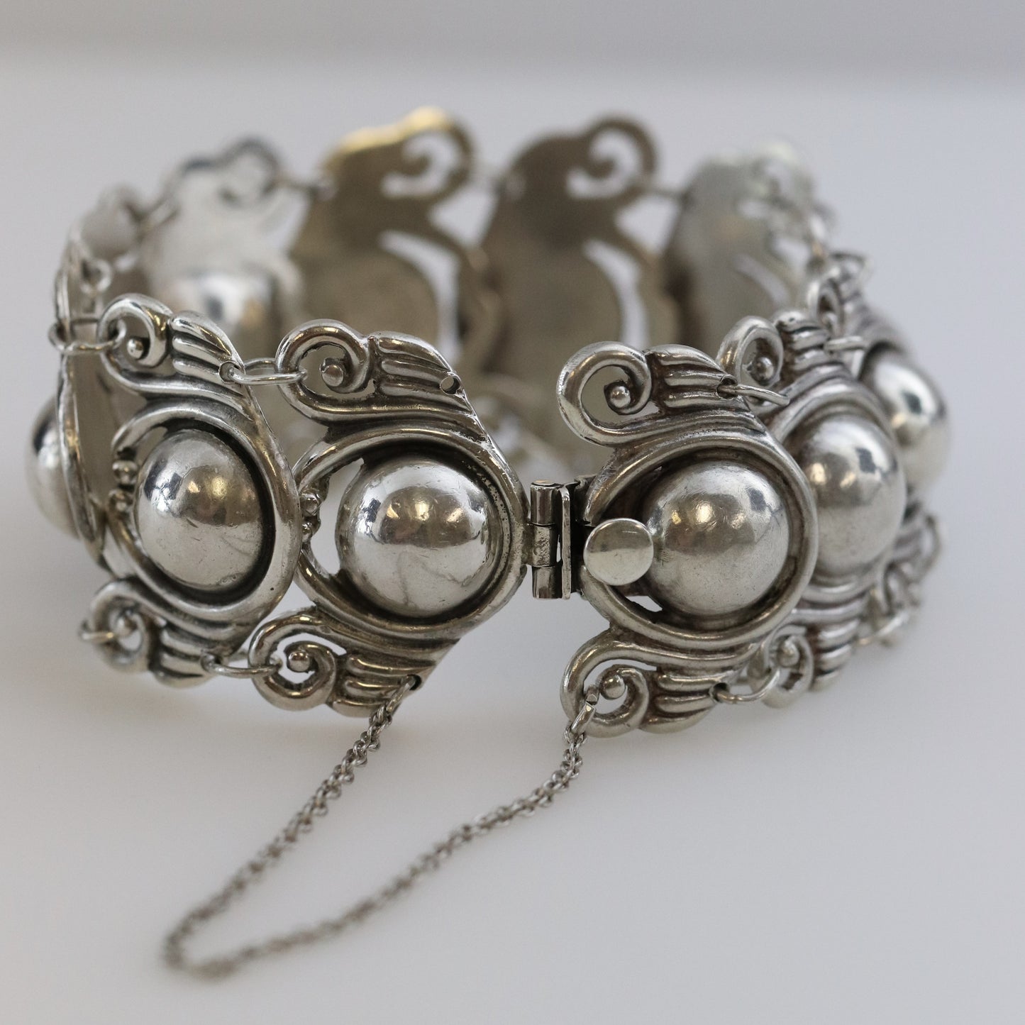 Los Castillo Taxco silver cabochon bracelet with ornate linked design and safety chain