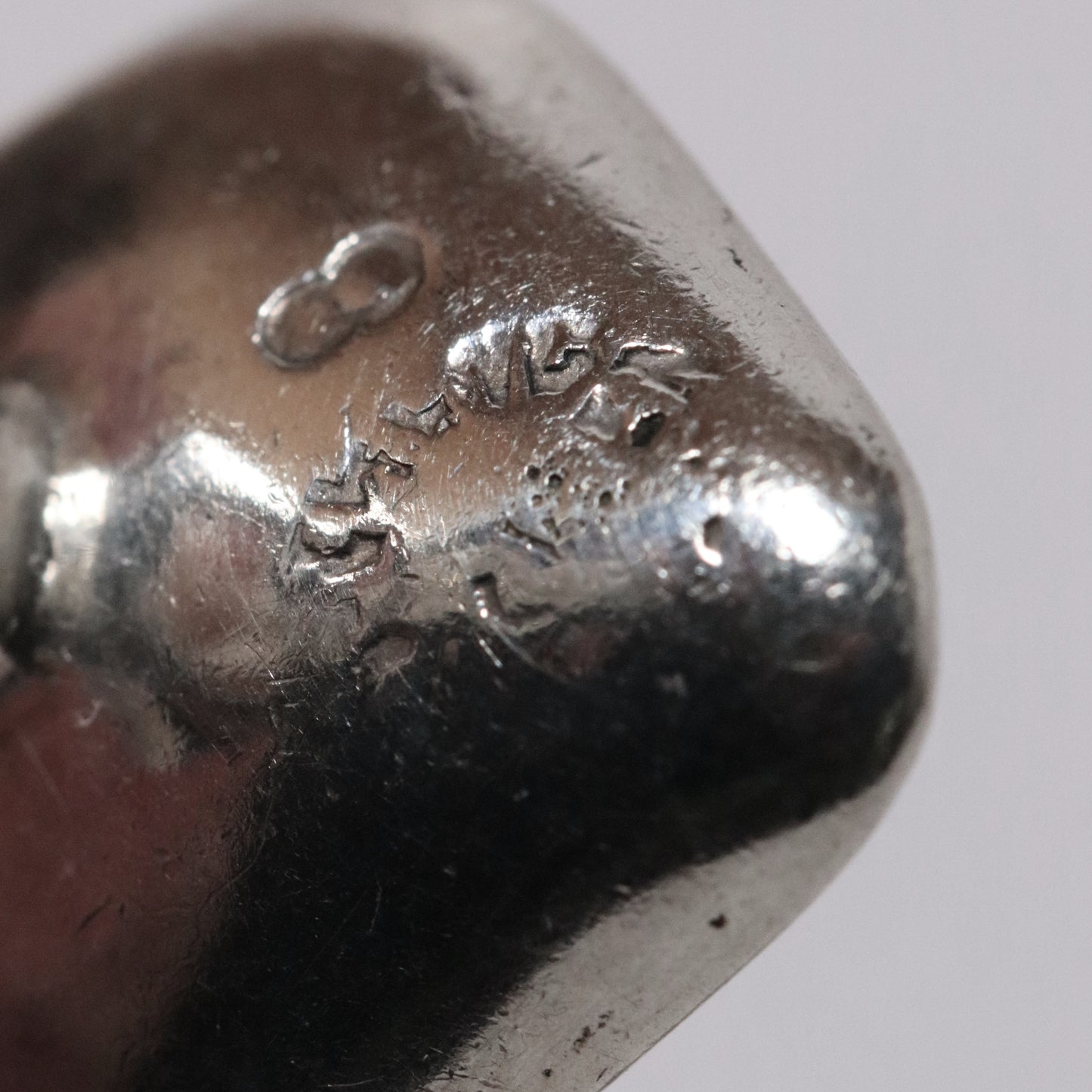 Close-up of Sigi Pineda Taxco silver cufflinks maker’s mark engraving
