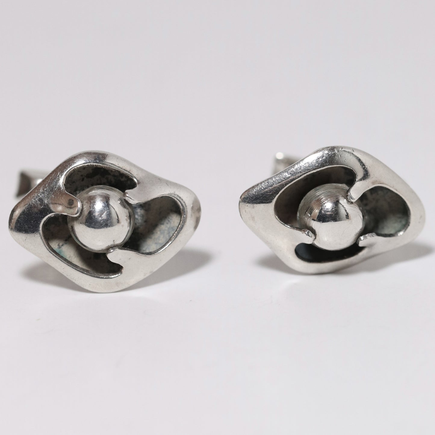 Sigi Pineda Taxco silver cufflinks with encased ball design, modernist jewelry