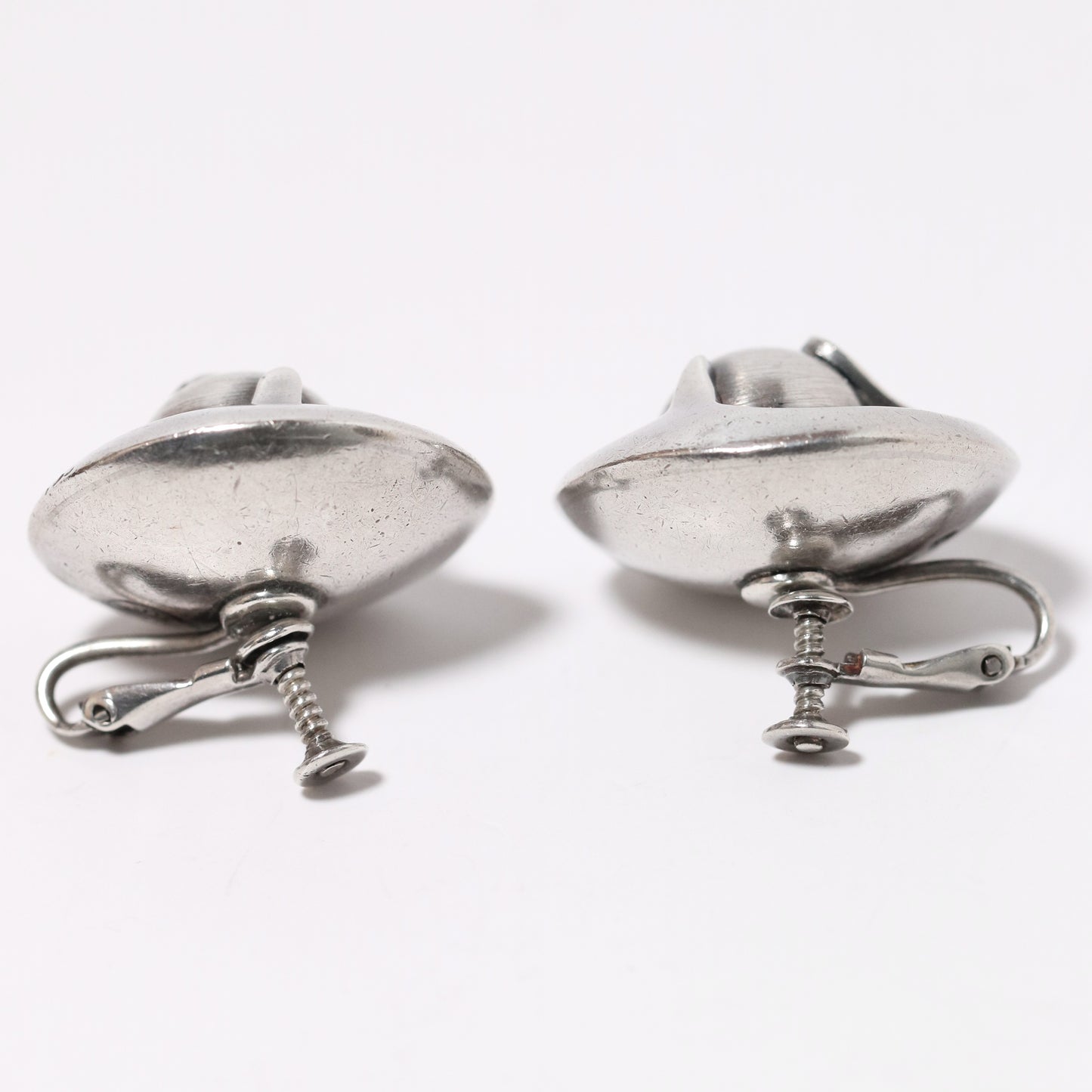 Sigi Pineda Taxco silver earrings with large encased ball and screw back design