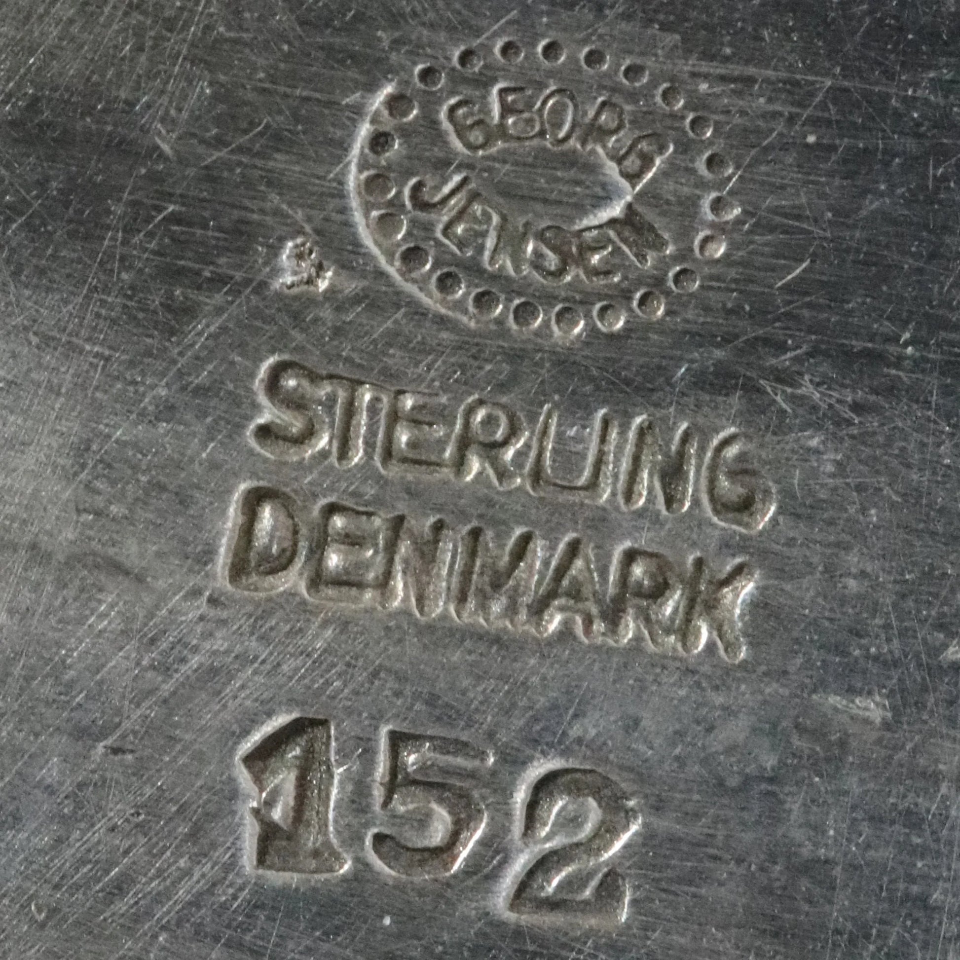 Georg Jensen sterling silver Denmark jewelry hallmark close-up on metal surface