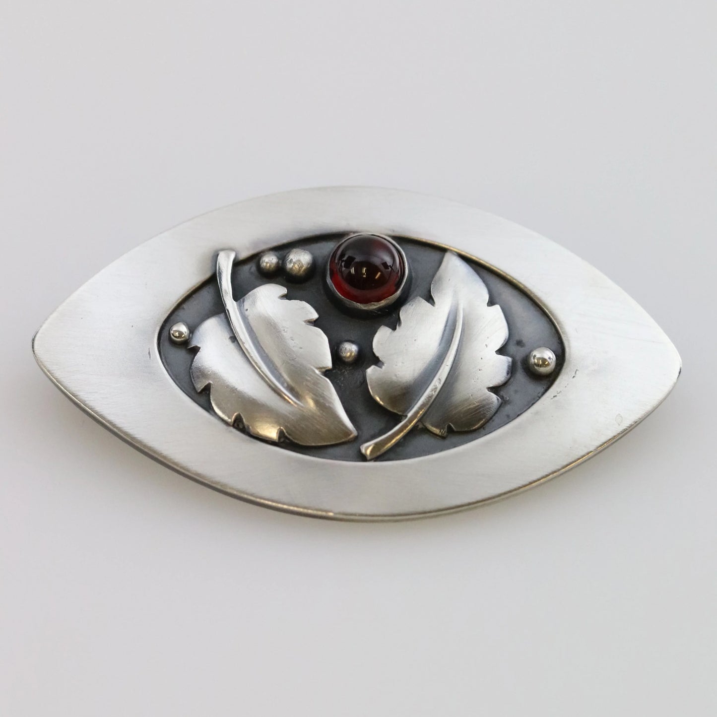 SOLD OUT: Vintage Lawrence Foss Silver Jewelry | Foliate and Garnet Brooch - Carmel Fine Silver Jewelry