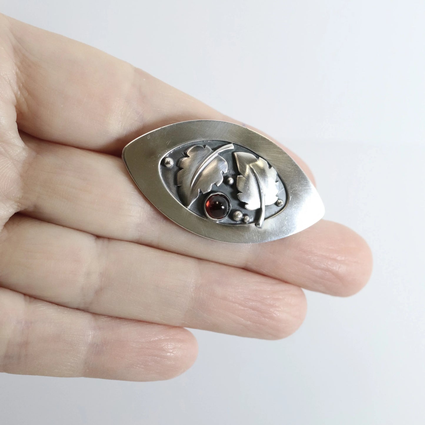 SOLD OUT: Vintage Lawrence Foss Silver Jewelry | Foliate and Garnet Brooch - Carmel Fine Silver Jewelry