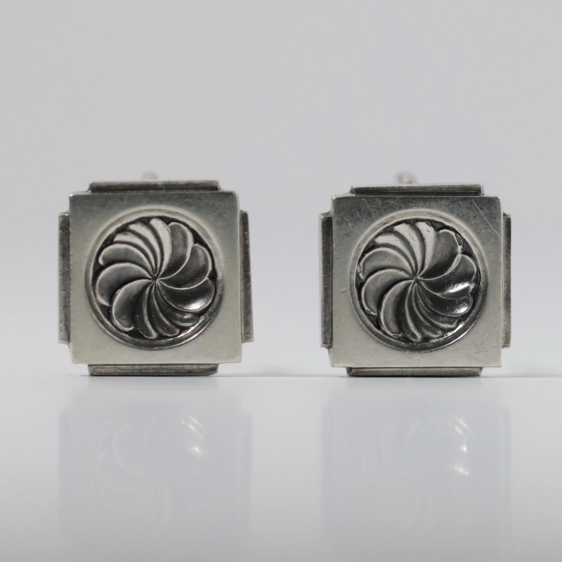 Vintage Georg Jensen Henry Pilstrup silver square earrings with swirl design